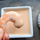 shrimp dipped into michelada sauce